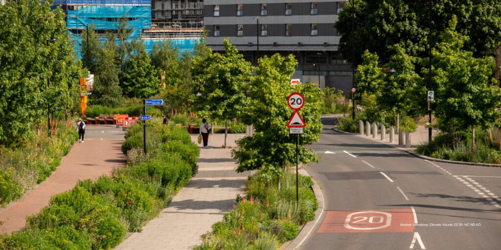 A road, cycle lane and footpath in Sheffield where plants, greenery and trees have been planted in between each.